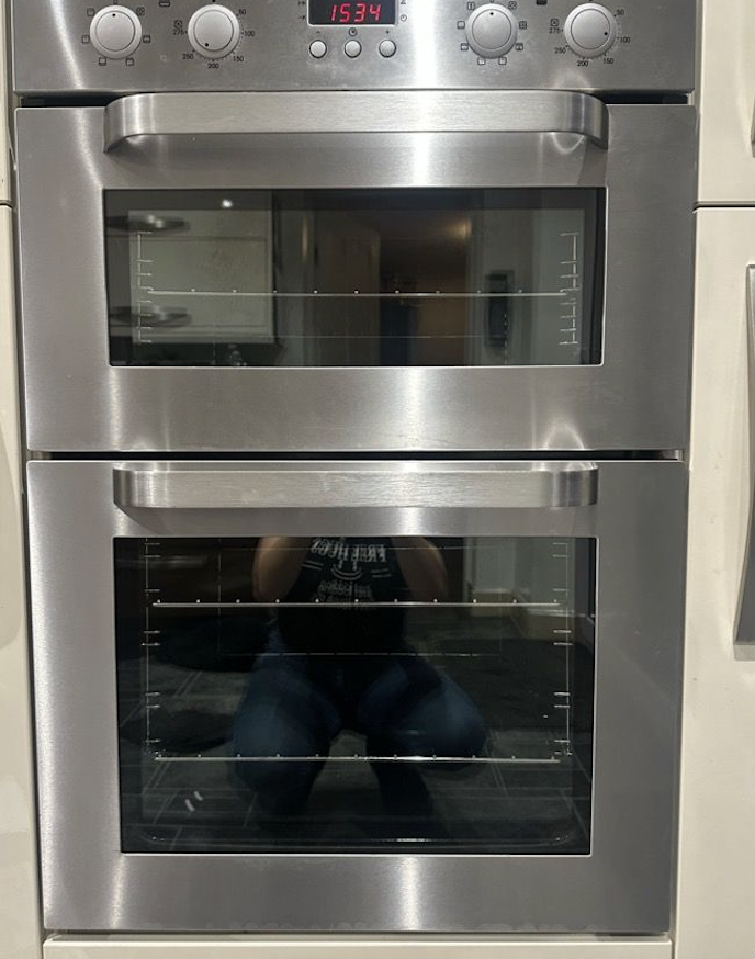 Double oven after professional cleaning - sparkling clean glass and pristine finish