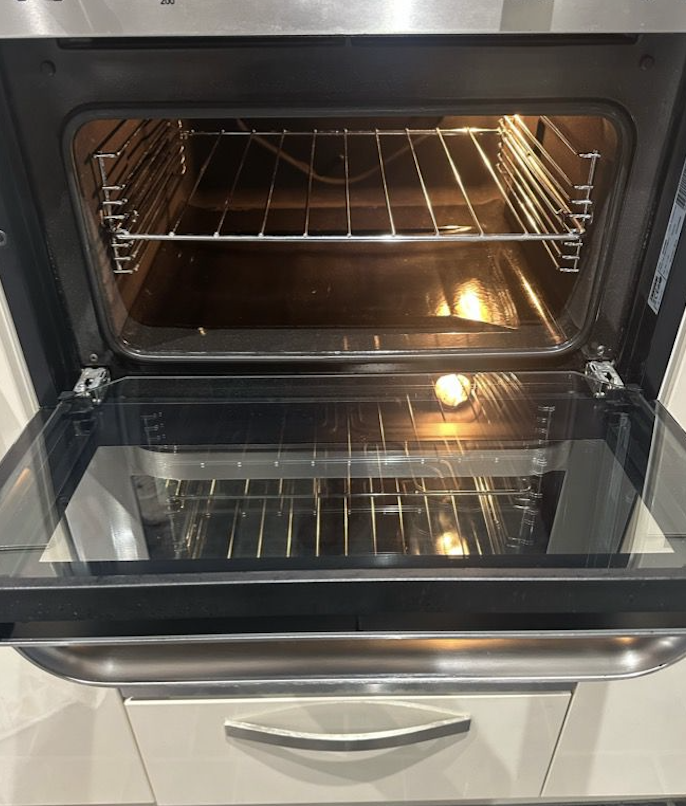 Oven interior after cleaning - gleaming clean with sparkling racks