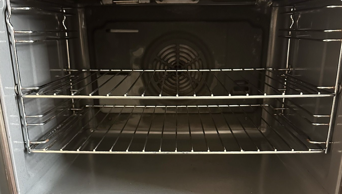 Oven interior after cleaning - sparkling clean racks and surfaces