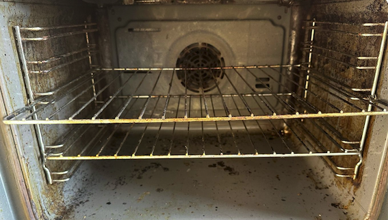 Oven interior before cleaning - dirty racks and grease buildup