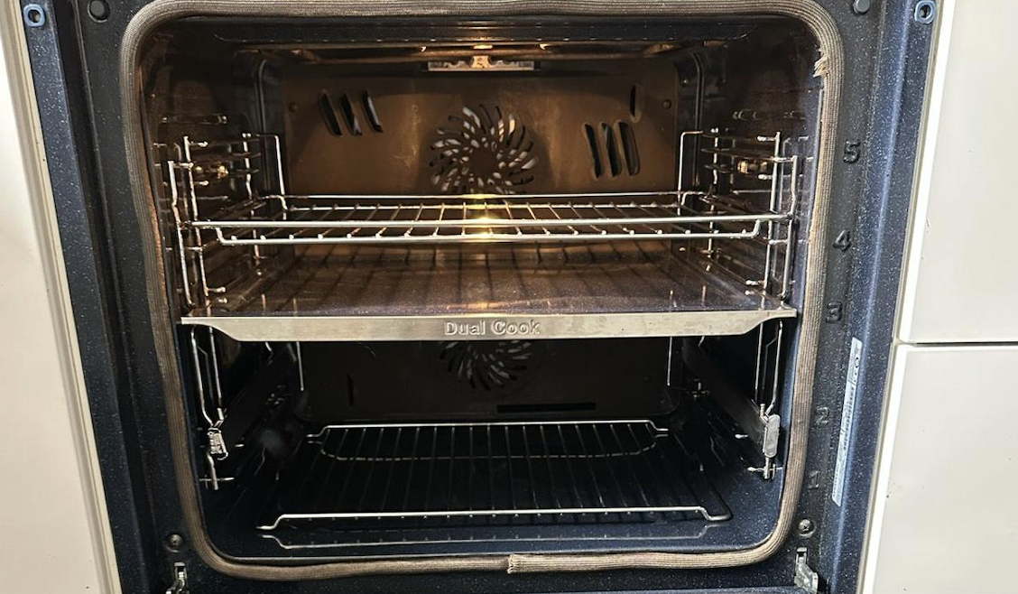 Oven interior after cleaning - gleaming clean racks and surfaces