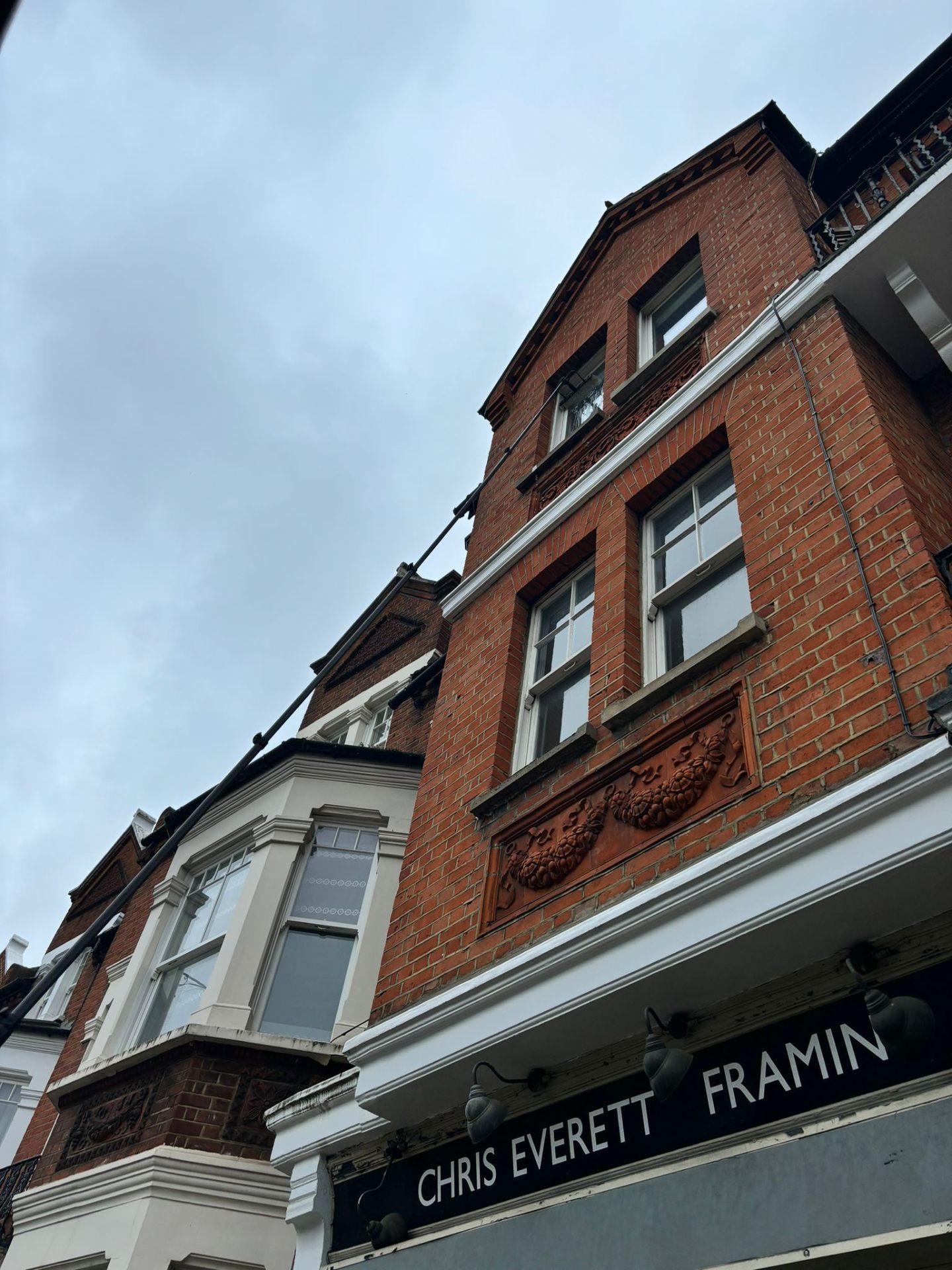 Window cleaning equipment and technician at historic commercial building