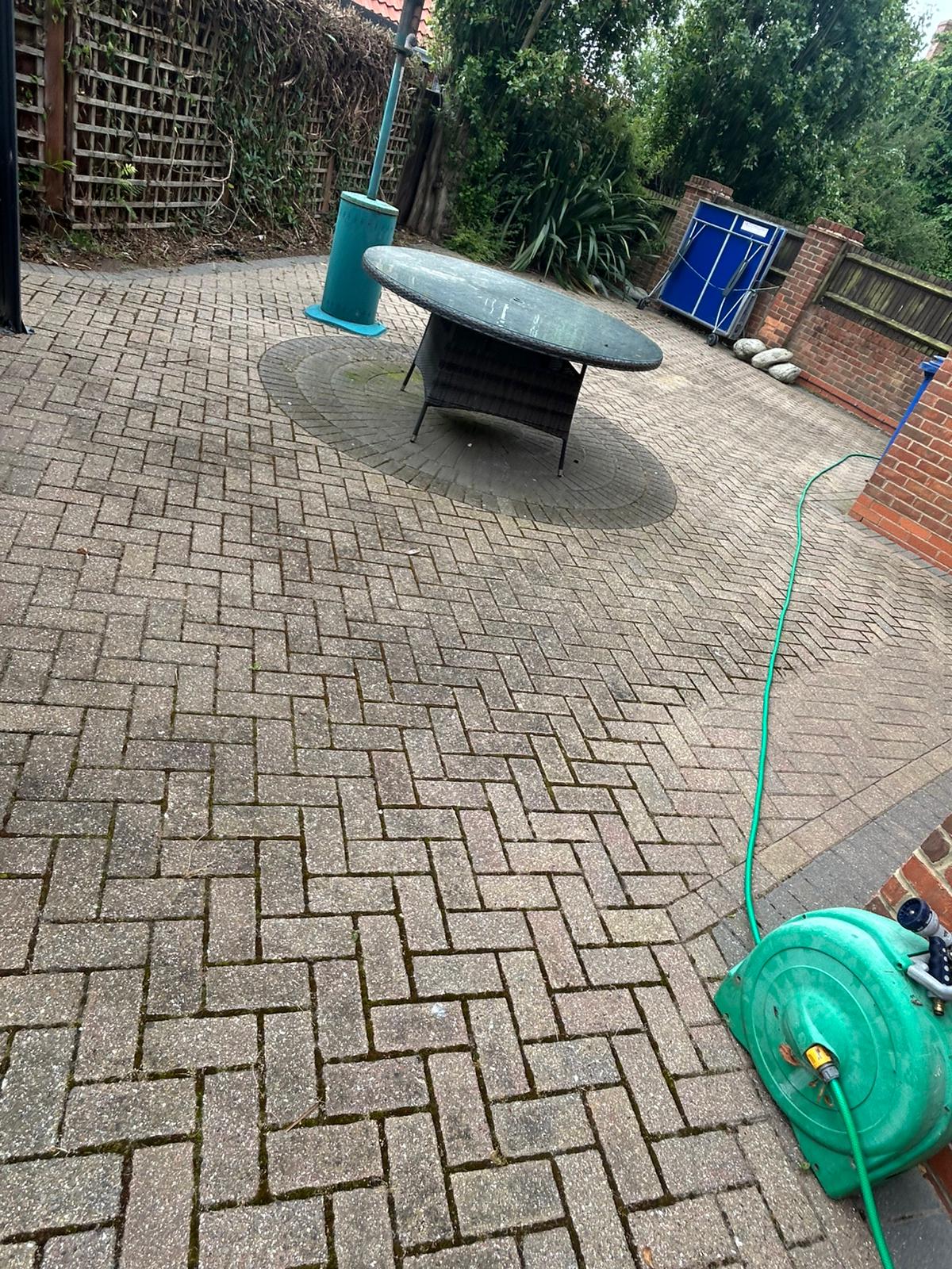 Before - Large patio area with staining and dirt buildup