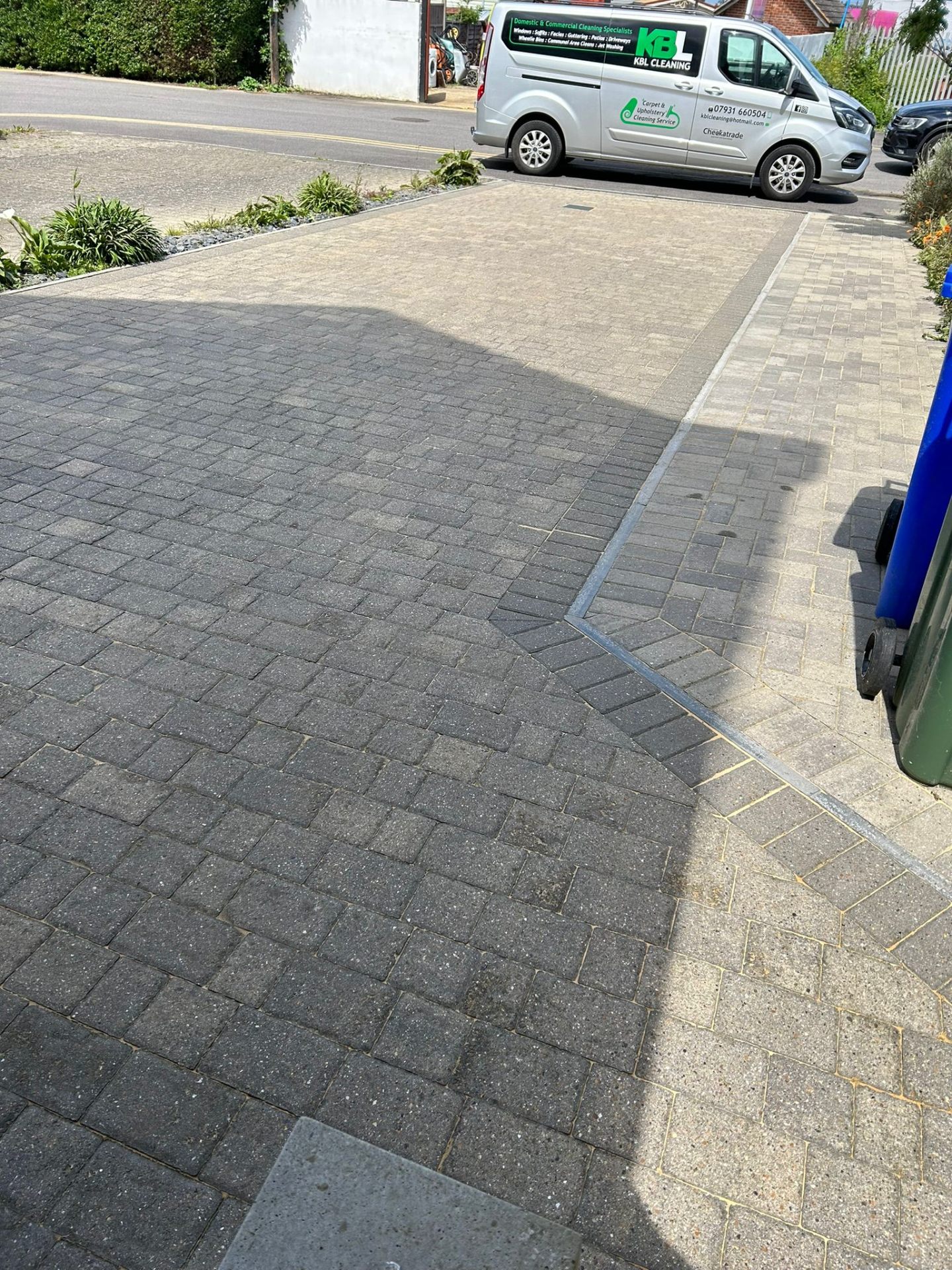 After - Clean driveway with restored surface