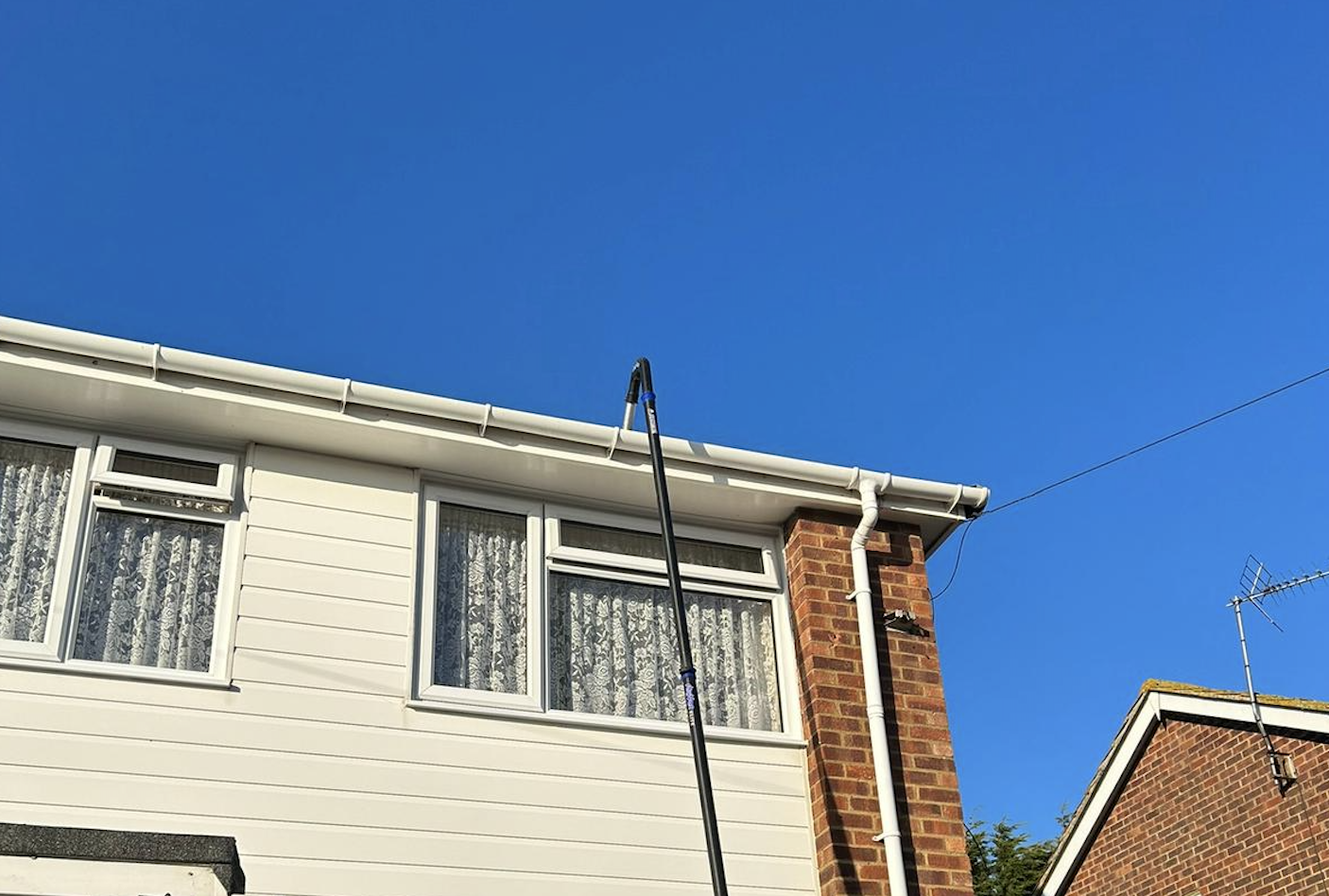 Specialist gutter vacuum system removing leaves and blockages