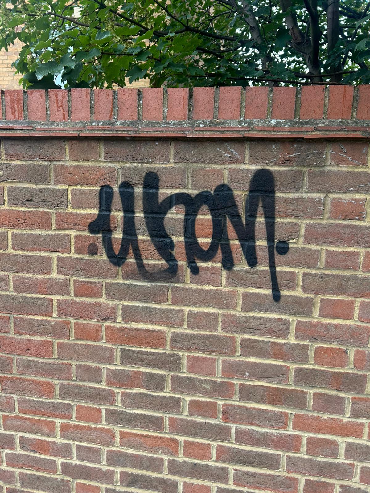 After - Red brick wall restored to original condition