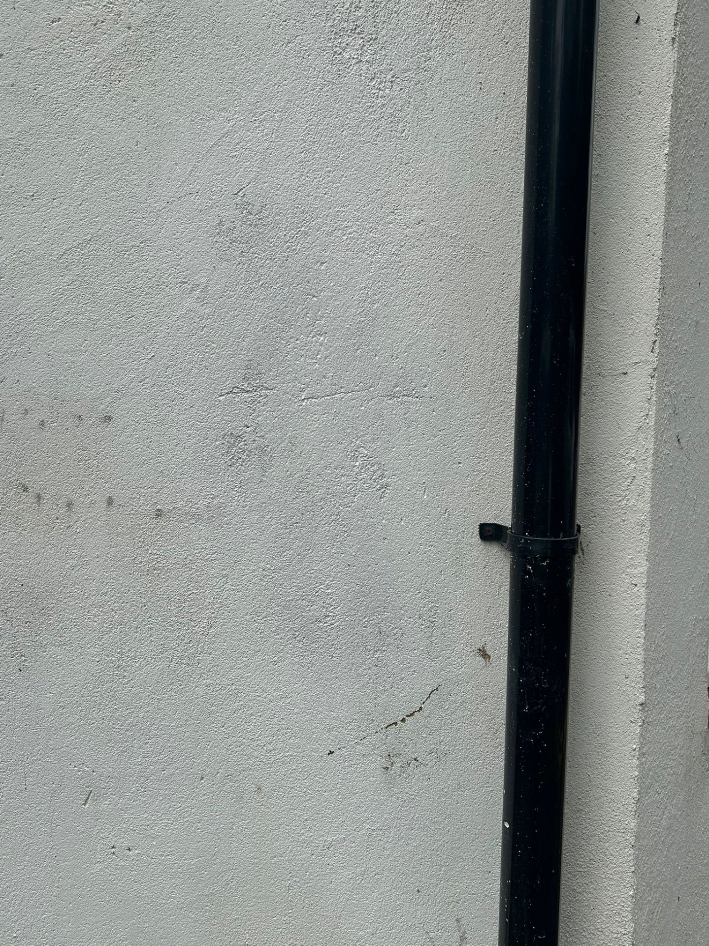 Before - Graffiti vandalism on rendered wall