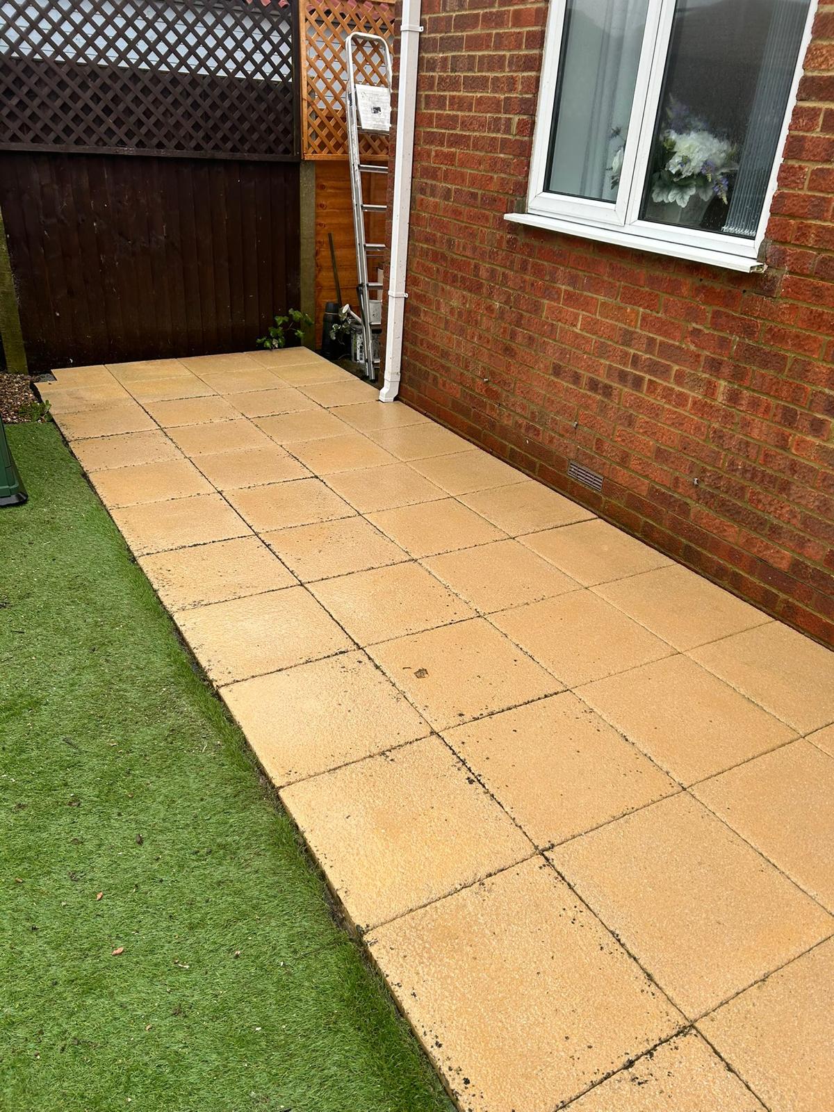 After - Clean patio slabs restored through professional jet washing