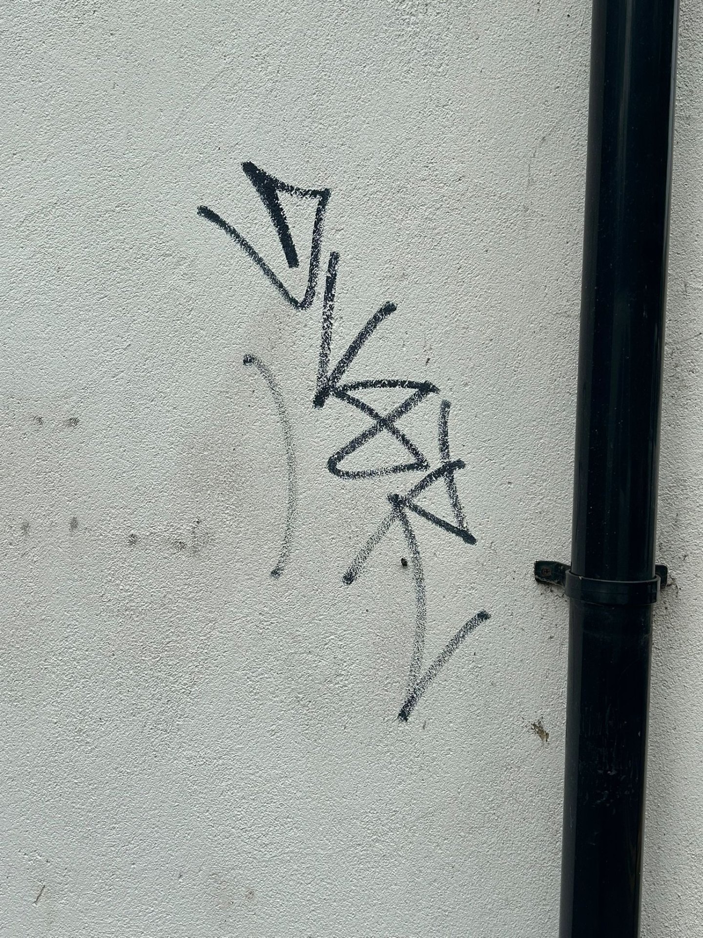 After - Rendered wall restored to clean finish