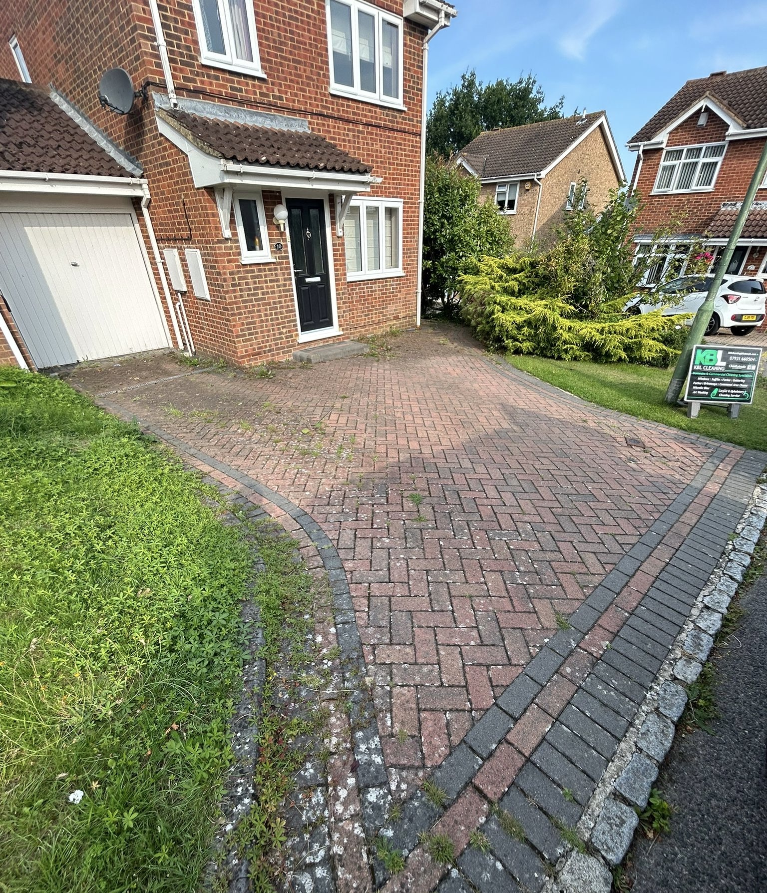Before - Block paving driveway with stains and wear