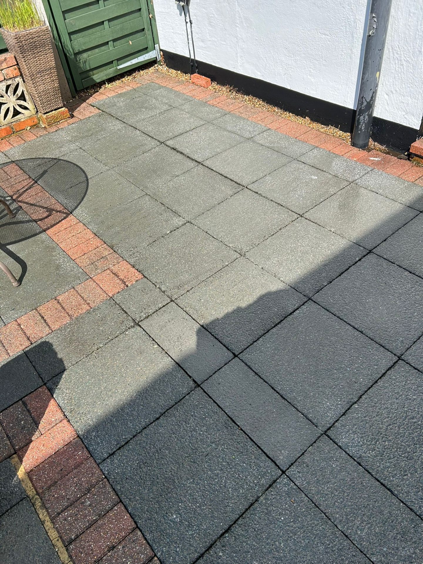 After - Restored patio with clean brick edging