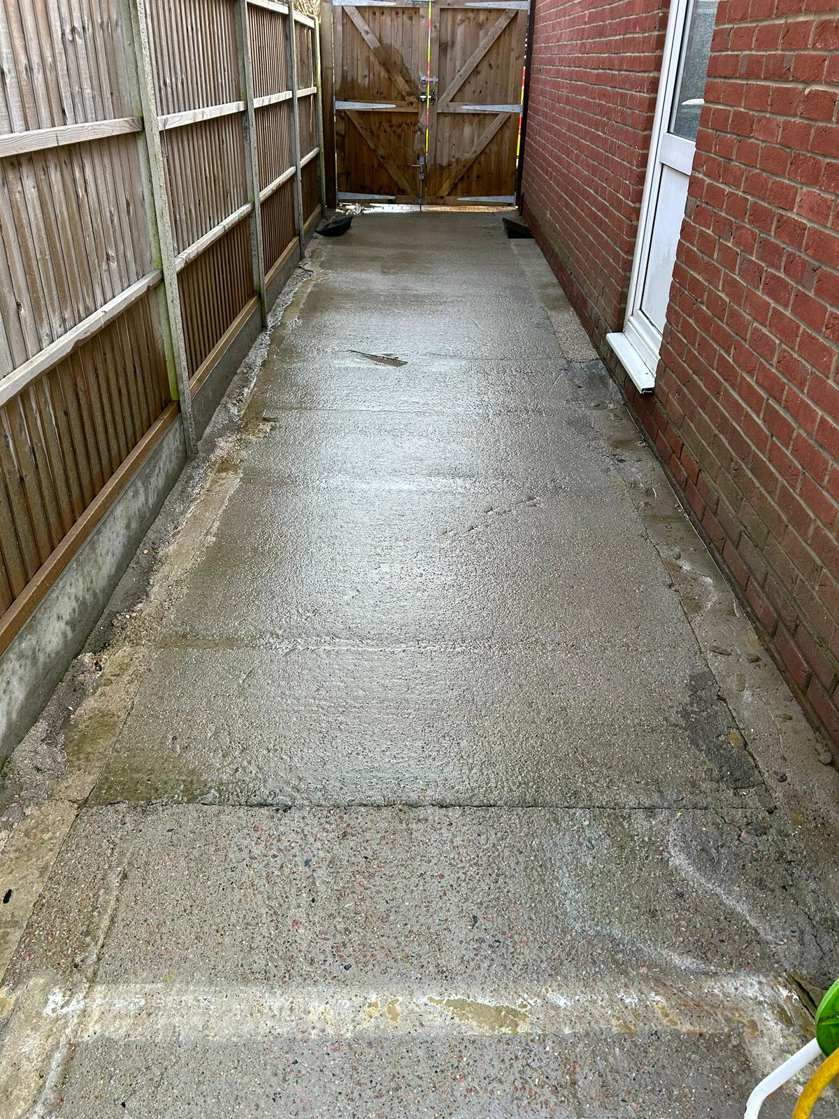 After - Clean concrete patio after professional jet washing