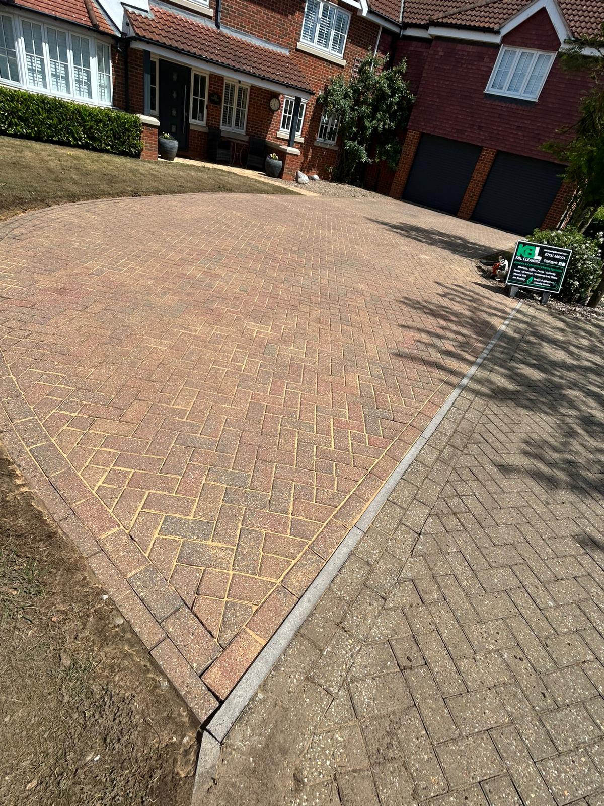 Professional driveway cleaning showing before and after results on block paving