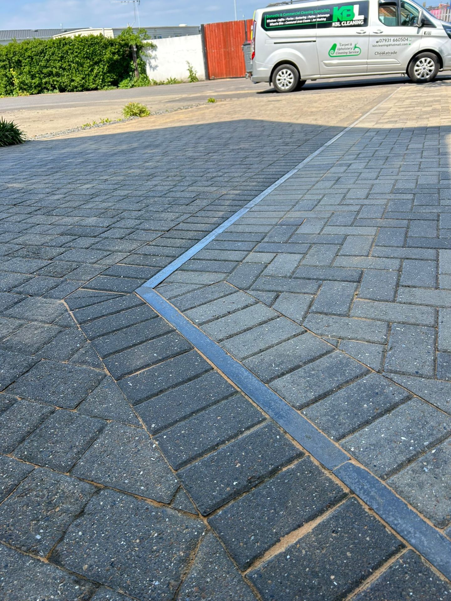 Professionally cleaned block paving driveway with KBL Cleaning van