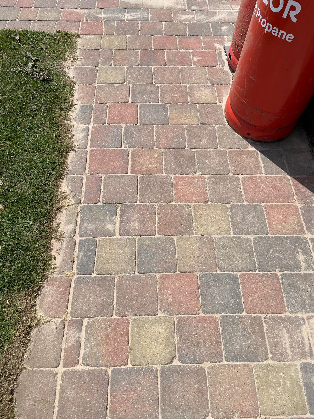 Block paving cleaning showing clean brick pavers with professional maintenance results