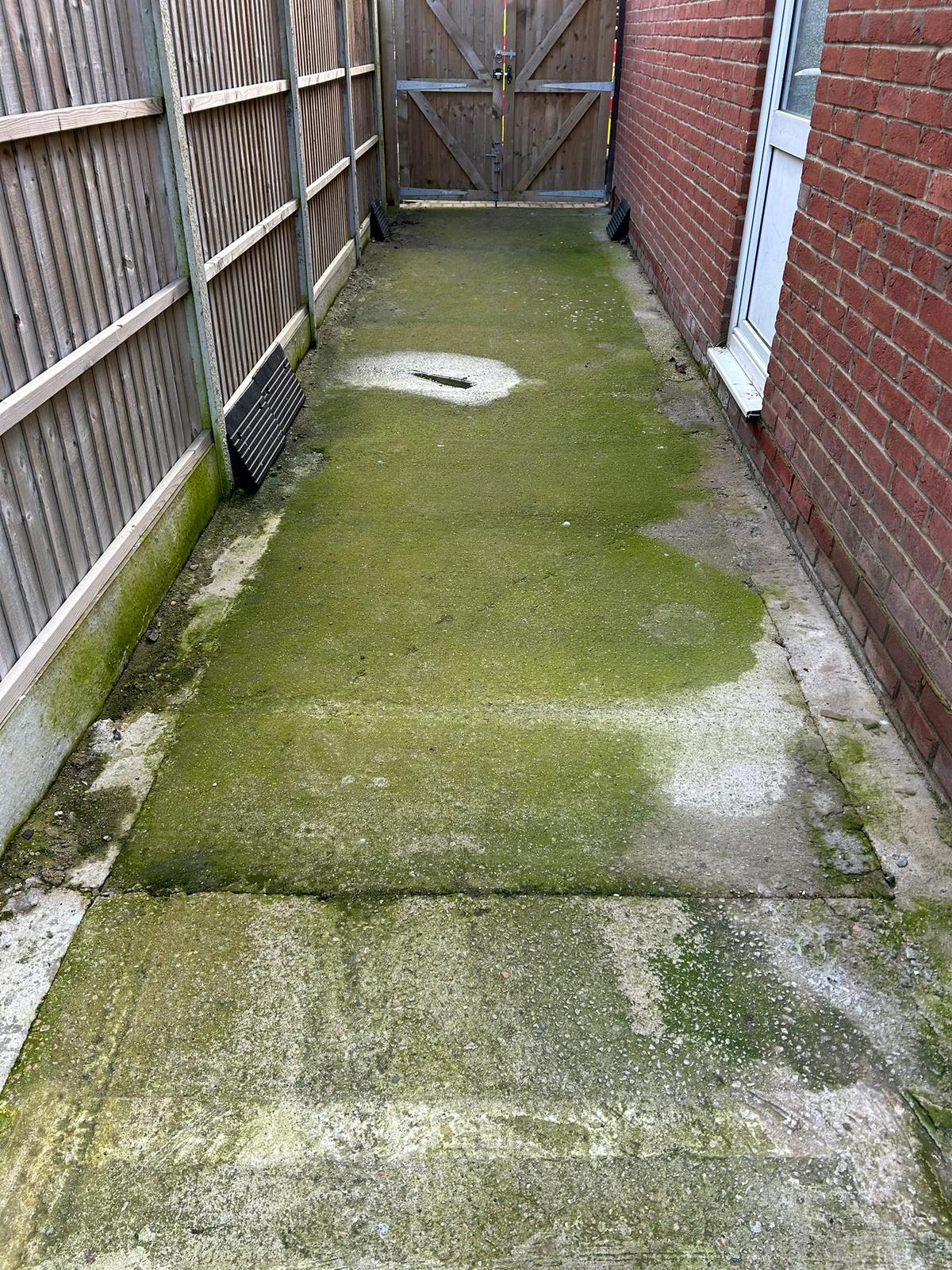 Before - Patio covered in moss and algae requiring jet washing