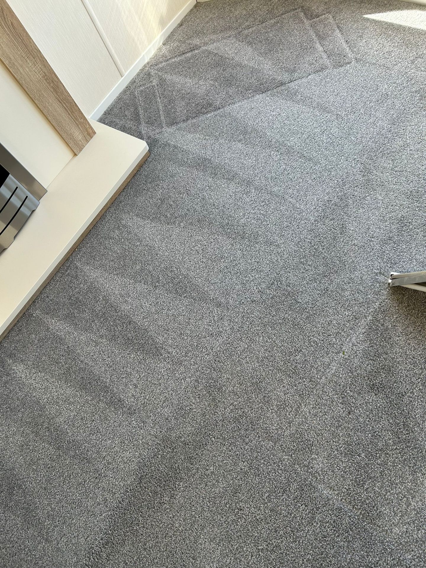 Close-up of professionally cleaned grey carpet showing texture