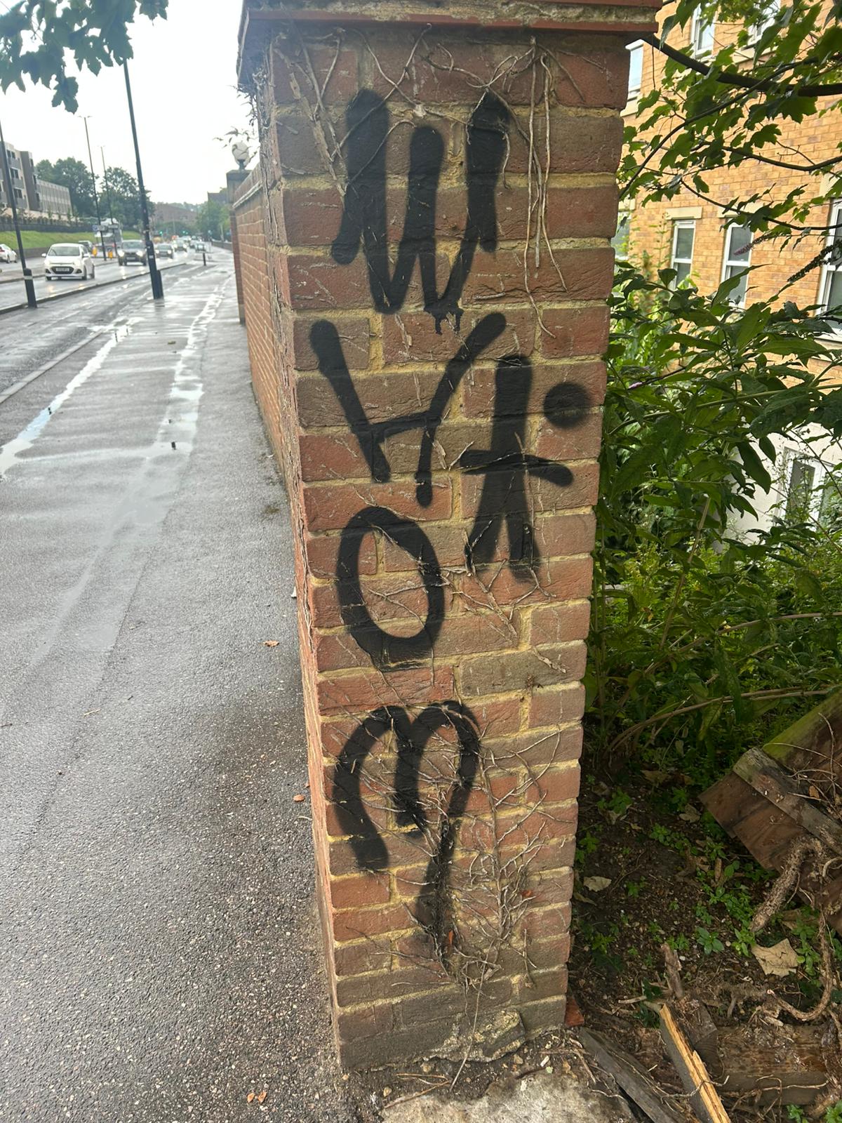 After - Brick pillar cleaned with graffiti removed