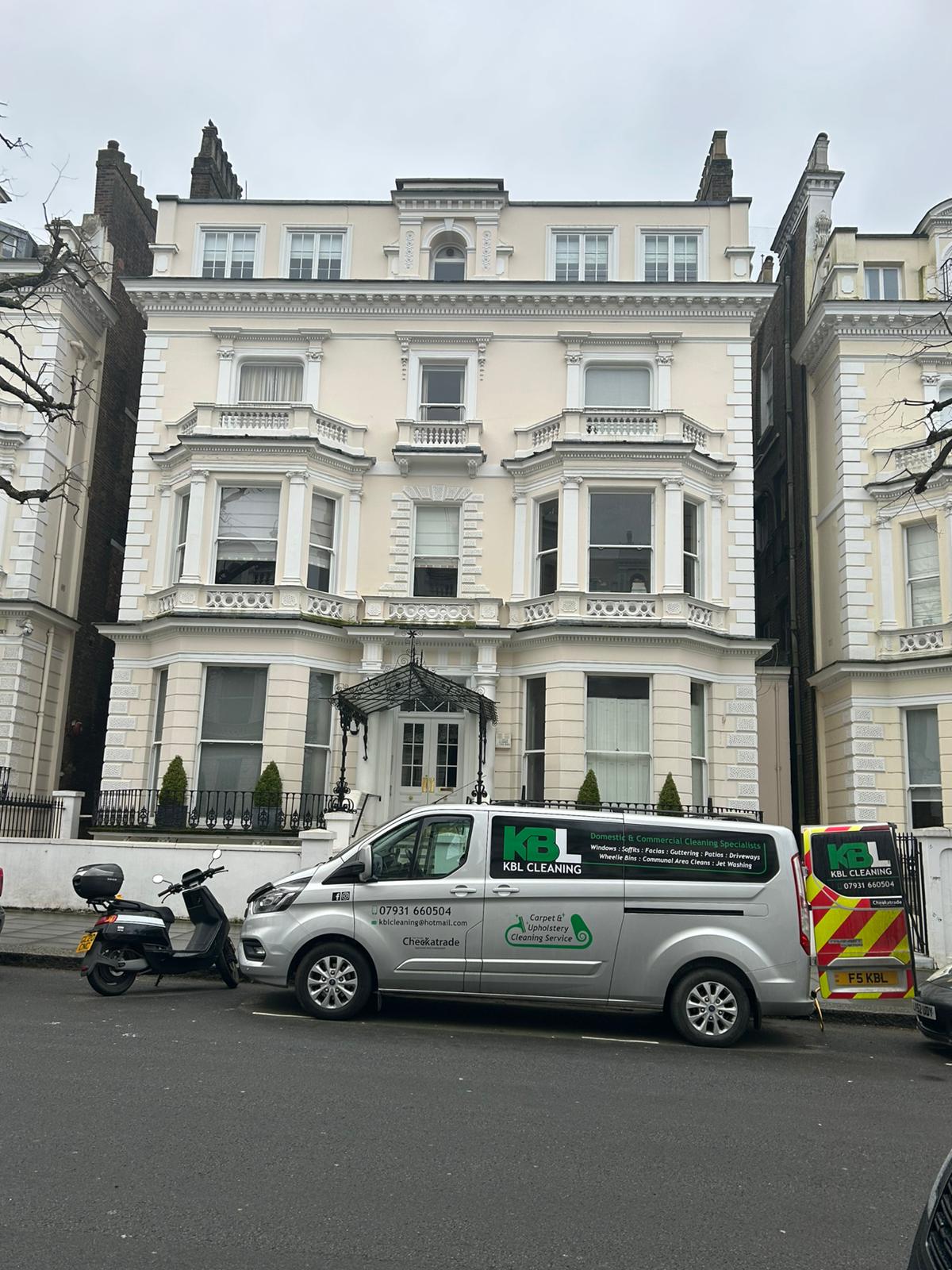 Traditional window cleaning by hand with squeegee and cloth