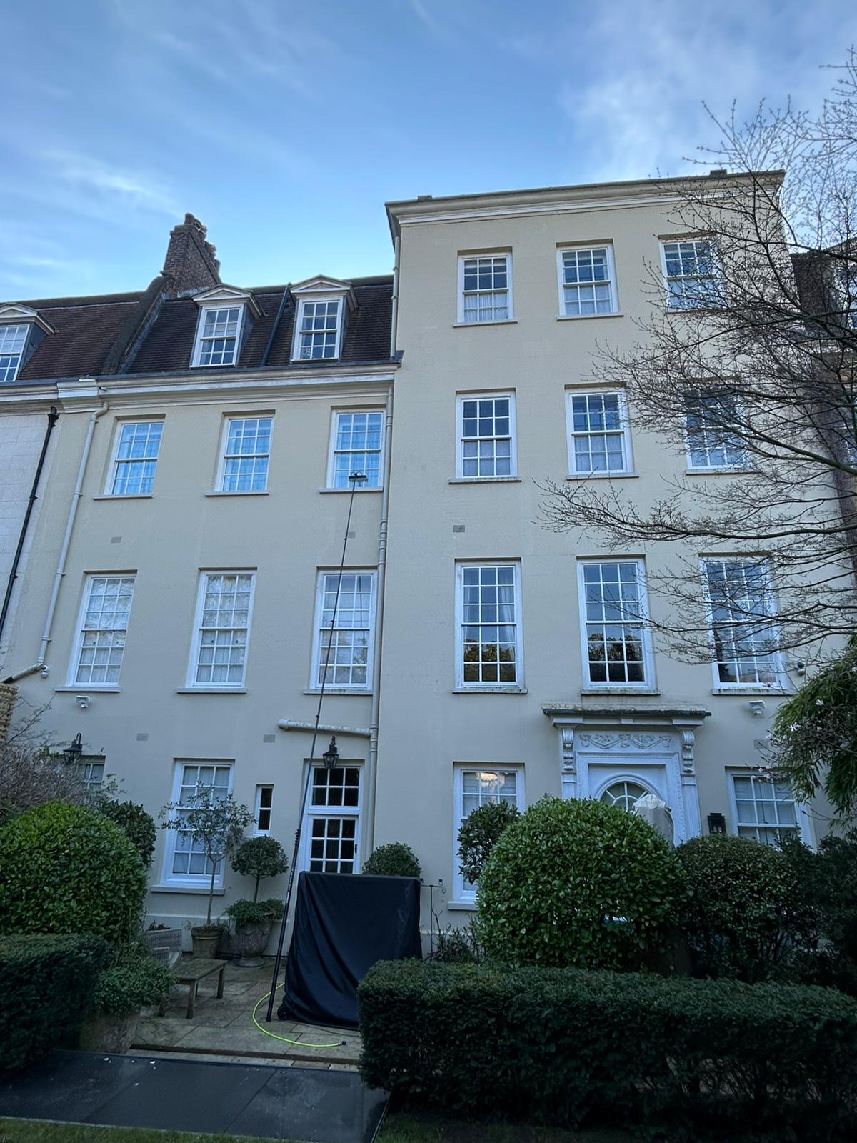 Georgian townhouse with multiple windows professional cleaning service
