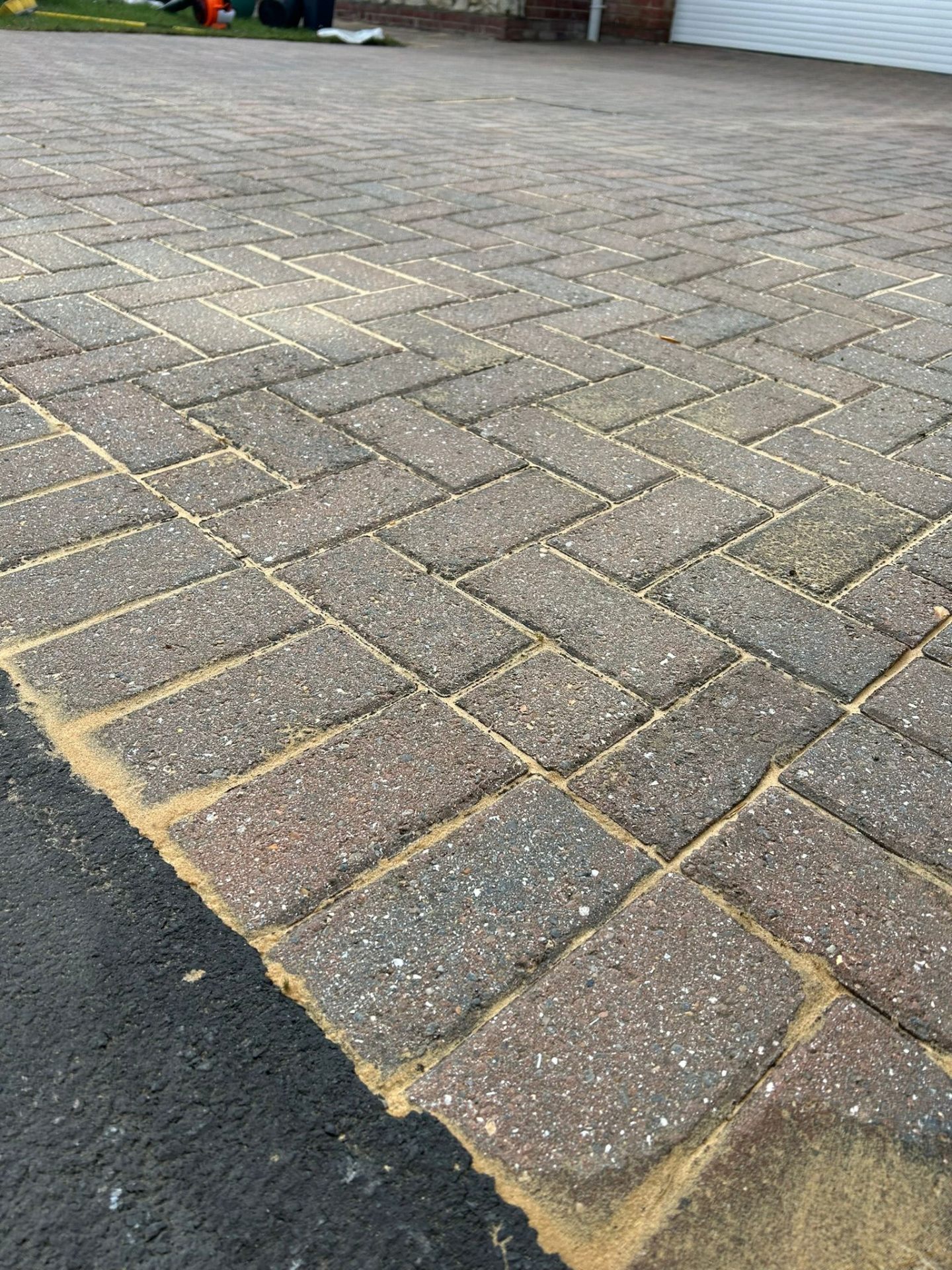 Detailed herringbone pattern block paving after professional cleaning